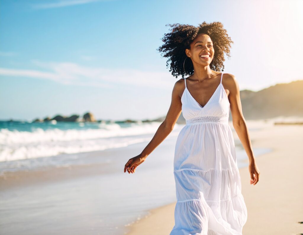 firefly ethnic model walking happy beach white dress sunny 855758