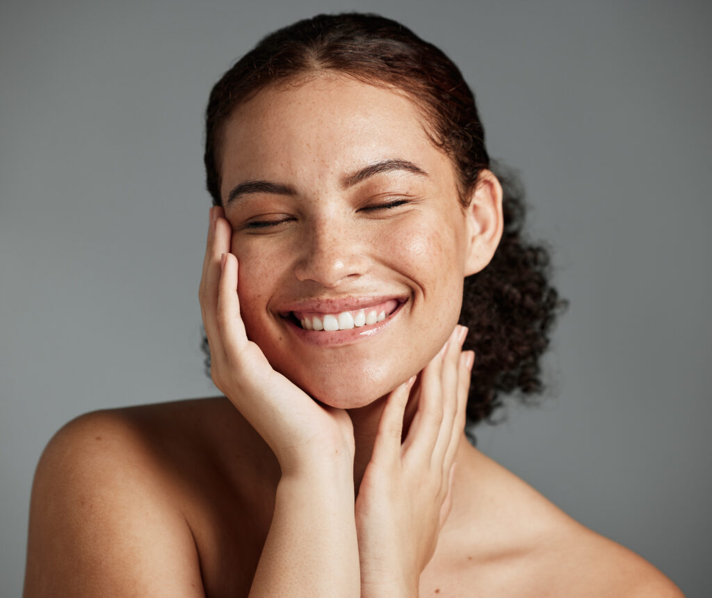 face, beauty and satisfaction with a model black woman in studio on a gray background to promote natural skincare. facial, wellness and makeup with an attractive young female happy with cosmetics