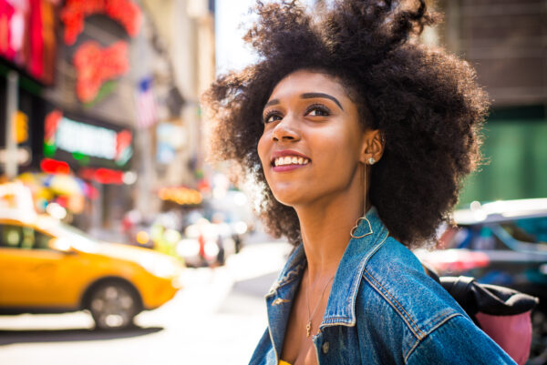 beautiful afro american woman walking in new york young black female adult tourist in manhattan, usa