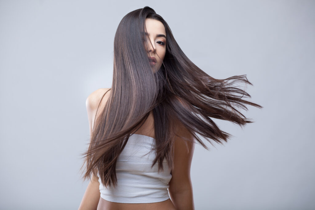 beautiful brunette girl with healthy long hair